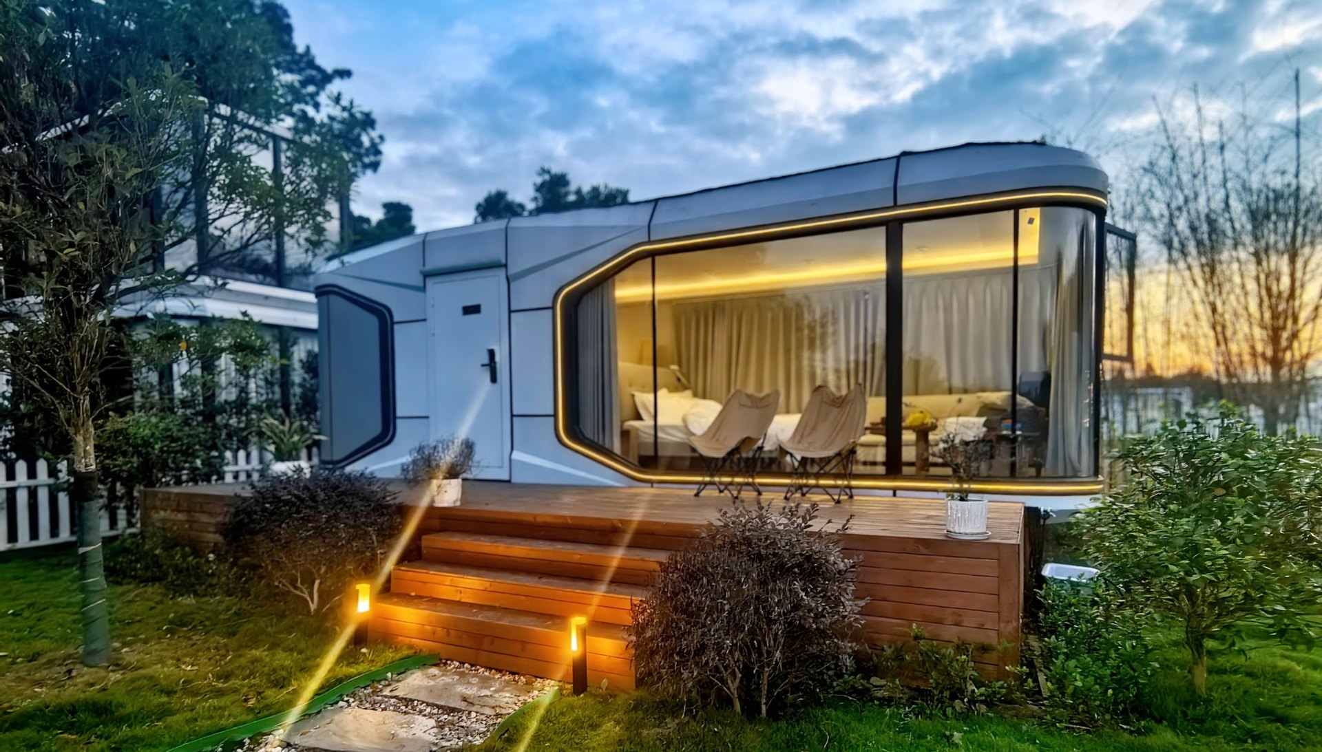 Capsule with lit garden steps at night