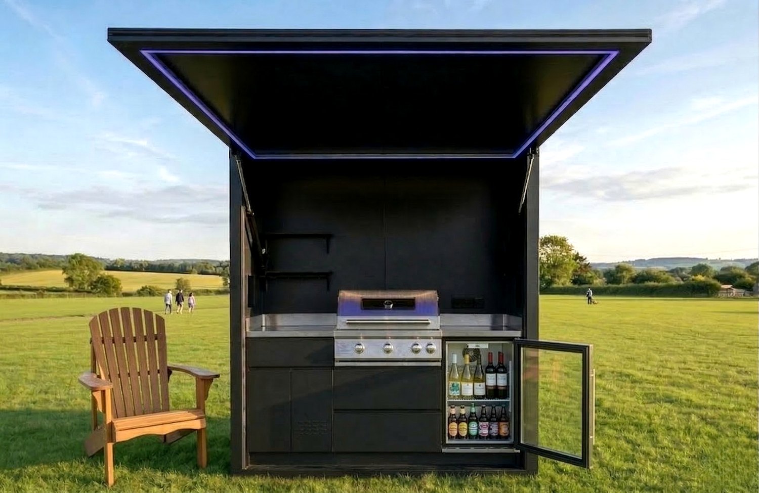 Automatic lift-up outdoor kitchen open on a lawn