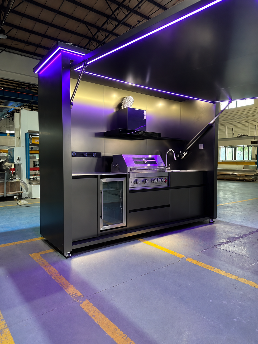 Automatic lift-up outdoor kitchen with hydraulic canopy and purple LED lighting