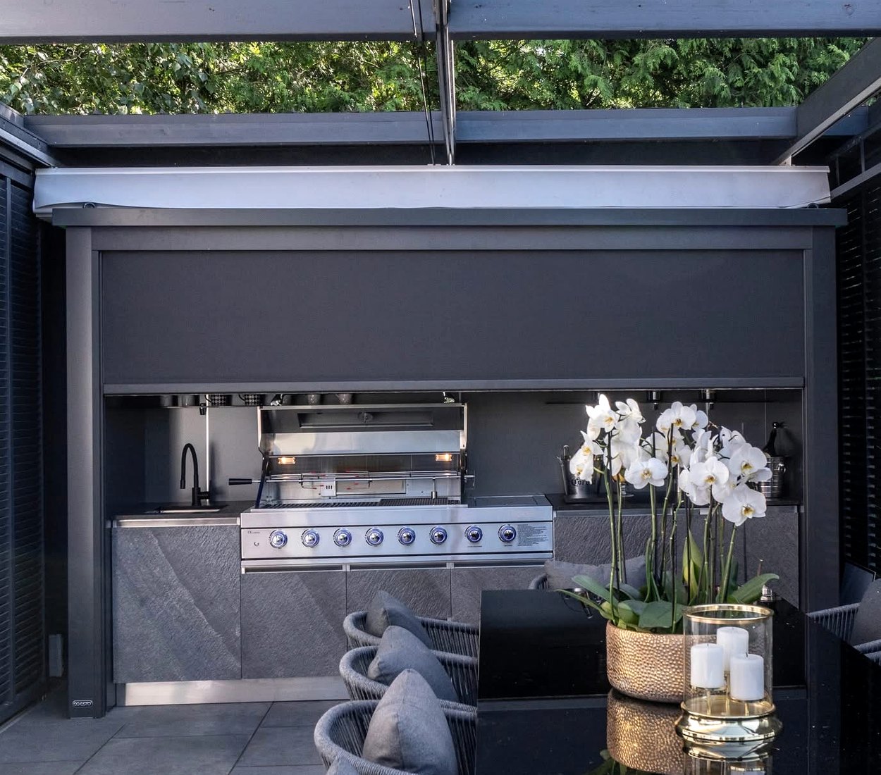 Roll-up outdoor kitchen installed near garden landscape