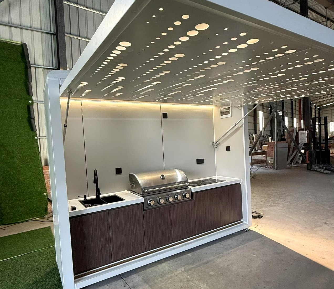 Star ceiling outdoor kitchen evening view with lighting